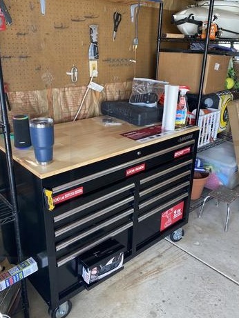 HuskyTool 46 in. W x 24.5 in. D 9-Drawer Gloss Black Deep Tool Chest Mobile Workbench with Hardwood Top and Power Station, Red, (H46MWC9V2PWR)
